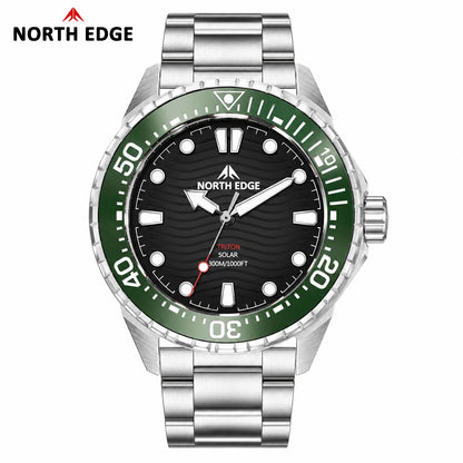 A North Edge men's stainless steel watch with a silver-tone metal link bracelet, a black dial, and a green rotating bezel with white numerals. The brand logo is shown in the top-left corner on a plain white background.